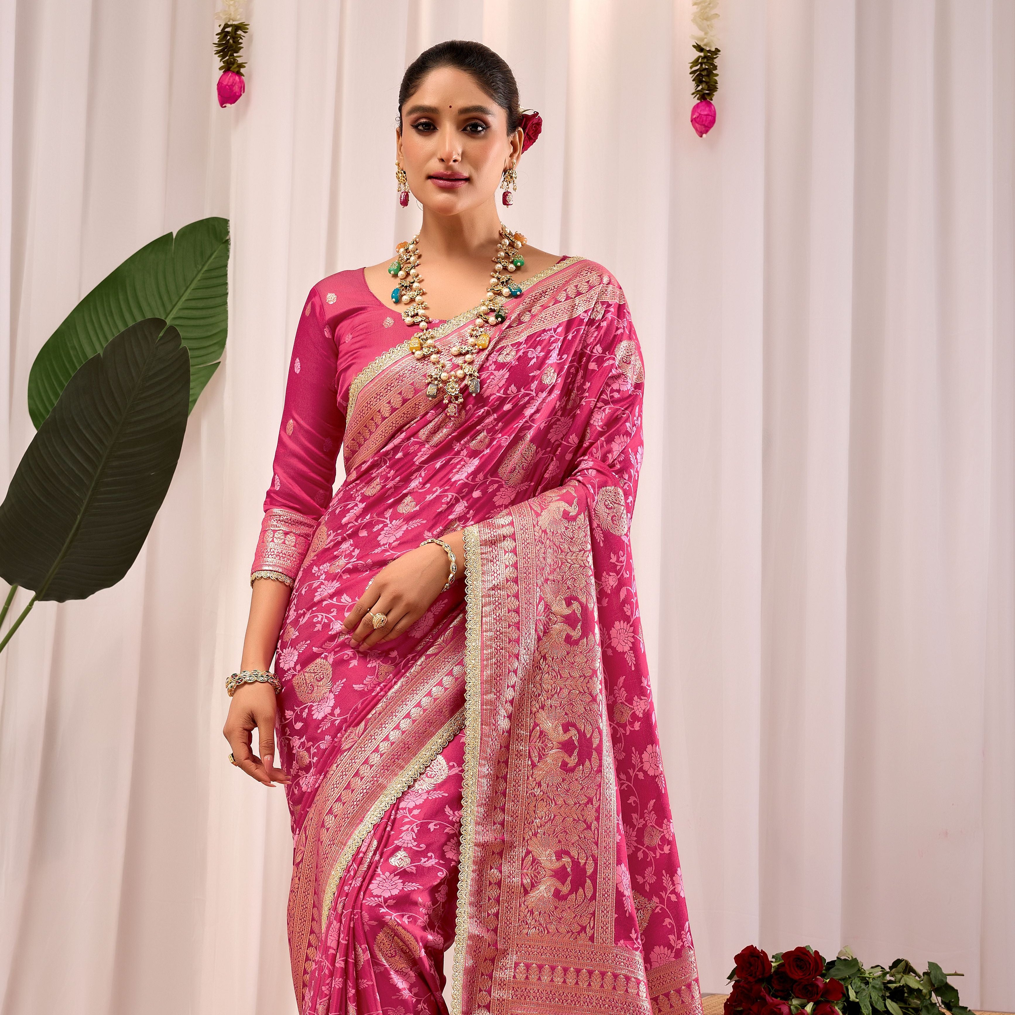 Elegant Rose Pink Floral Saree Featuring Traditional Motifs and Rich Zari Border for Festive Occasions