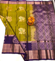 Premium Olive Green Kanchipuram Silk Saree with Lavender Purple Contrast Border & Rich Silver Zari Peacock Motifs | Luxury Wedding & Festive Silk Saree for Women